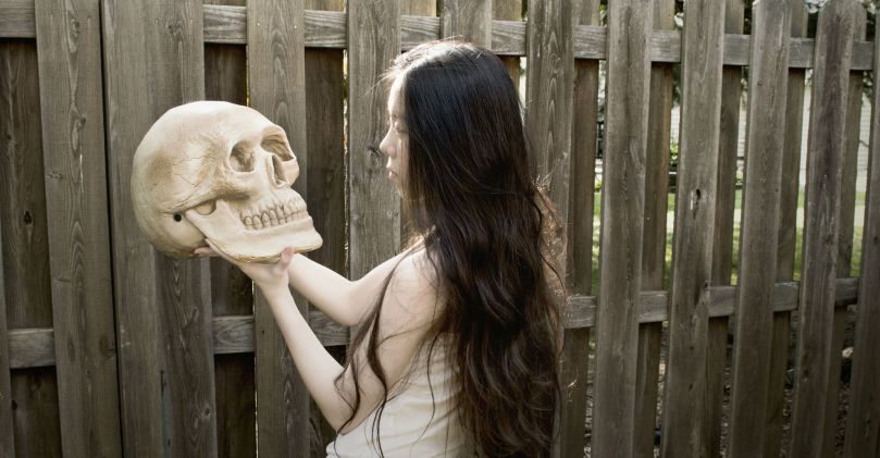 A major part of grieving practices, in almost every single religion, is interaction with the person's dead body. This helps us, psychologically, to face and come to grips with the reality of death. An emblem of death, such as a skull, can stand in for the deceased where it is impossible to perform ritual actions on their remains. The ceramic skull, here, becomes a proxy. We come to terms with death and aide the passage of the soul by performing ritual actions on this skull. By beautifying the skull, through painting and anointing with sweet oil, we reduce the horror that we feel at this reality, which will come to each of us in due course. From: http://imgur.com/user/gracechen